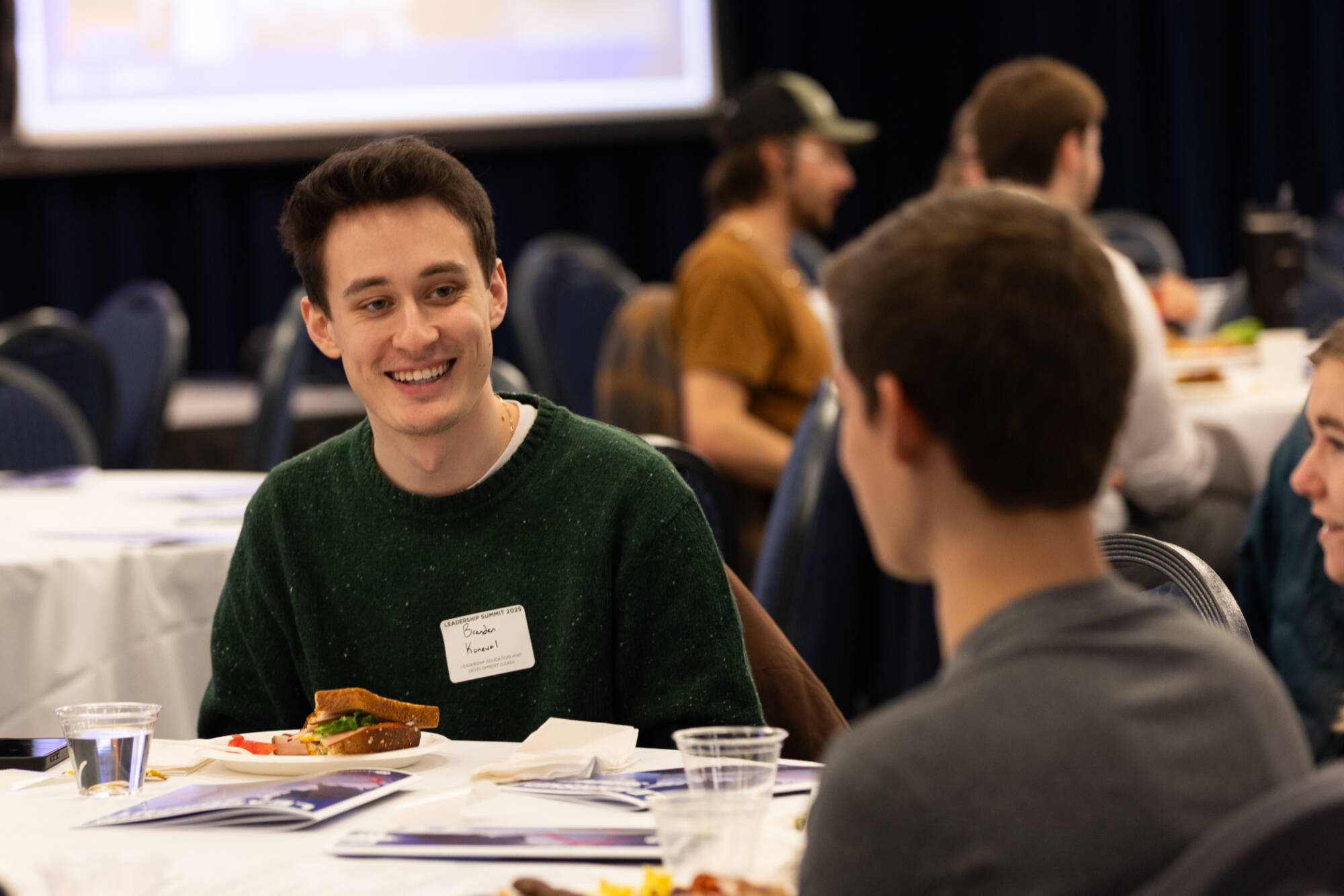 Students sitting at a table and chatting
